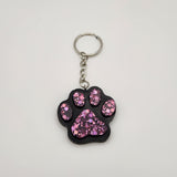 Hand-poured resin pawprint keychain supporting animal rescue