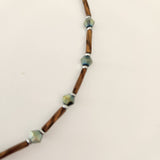 Handmade brown and iridescent green glass bead ankle bracelet by Blue Bourbon Designs