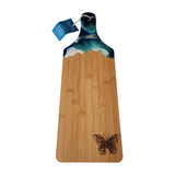 One-of-a-kind bamboo serving board with resin handle and hand-drawn butterfly