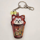 Cat drink shaker keychain filled with oil and floating charms