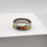 Dichroic resin ring with yellow, orange, and green color-shifting effect