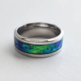 Hand-turned green dichroic resin ring shifting blue and green in the light