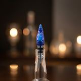 Resin tentacle bottle stopper with ocean-inspired blue and purple shimmer