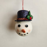 Handcrafted snowman ornament with snowy texture and glitter hat by Blue Bourbon Designs