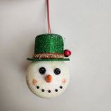 Handcrafted snowman ornament with snowy texture and glitter hat by Blue Bourbon Designs