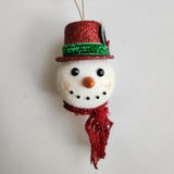 Handcrafted snowman ornament with snowy texture and glitter hat by Blue Bourbon Designs