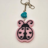 Hand-painted resin ladybug keychain with clear resin topcoat