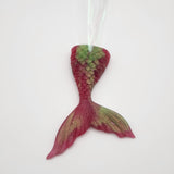 Hand-poured resin mermaid tail ornament in multiple colors.