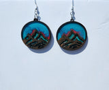 One-of-a-kind mountain earrings made from laser cut wood and resin with stainless steel hooks