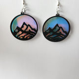 One-of-a-kind mountain earrings made from laser cut wood and resin with stainless steel hooks