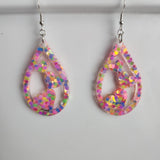 Teardrop resin earrings with heart accents in multiple colors by Blue Bourbon Designs