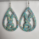 Translucent resin teardrop rabbit dangle earrings with colorful glitter on stainless steel hooks.