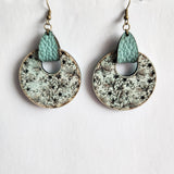 Round floral wood earrings hand-painted blueish green with matching leather tab and brass hooks