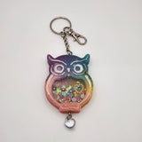 Owl shaker keychain filled with oil and floating charms