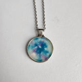 1-inch round resin necklace on silver stainless steel chain