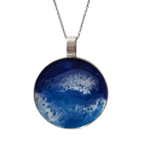 2-inch round ocean resin necklace with waves on a stainless steel chain