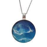 2-inch round ocean resin necklace with waves on a stainless steel chain