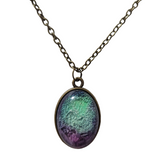 domed resin finish on brass colored chain