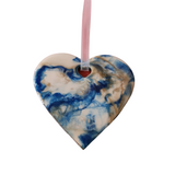 Handmade resin heart ornament with layered colors and iridescent hanger by Blue Bourbon Designs.