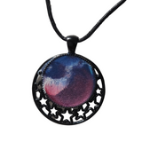 Round metal crescent moon and star pendant with resin center on a leather cord.