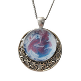 Round metal crescent moon and star pendant with resin center on stainless steel chain
