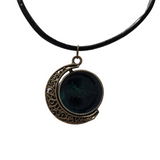 Reversible crescent moon pendant with two unique resin sides