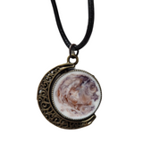 Reversible crescent moon pendant with two unique resin sides