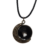 Double-sided resin moon necklace with brass crescent and black cord chain
