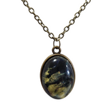 Oval alcohol ink resin necklace with domed resin finish on brass colored chain