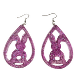 Translucent resin teardrop rabbit dangle earrings with colorful glitter on stainless steel hooks.