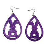 Translucent resin teardrop rabbit dangle earrings with colorful glitter on stainless steel hooks.
