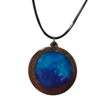 1.5 inch round wood pendant with resin-filled center on leather cord